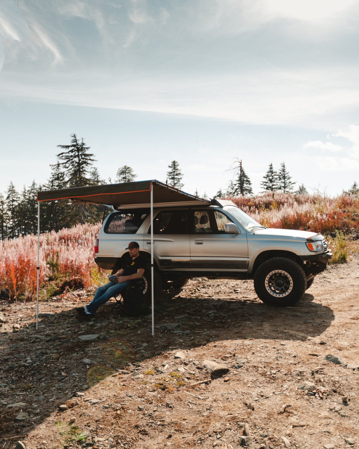 ROAM Rooftop Awning shading a vehicle at camp