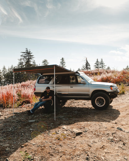 ROAM Rooftop Awning shading a vehicle at camp